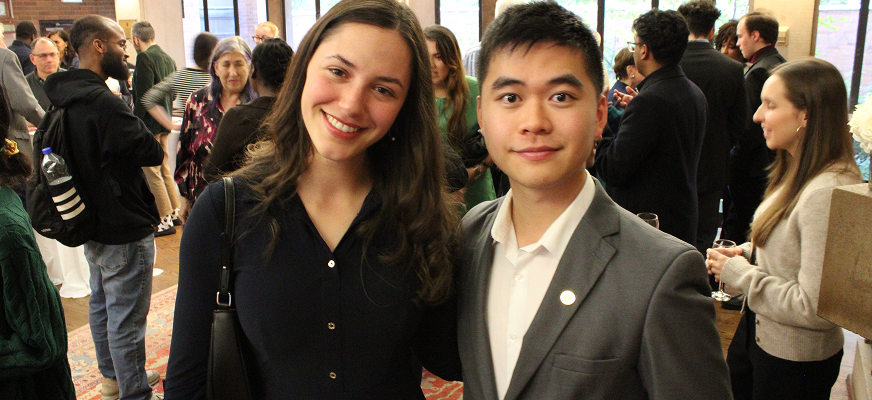 Two Junior Fellowship students stand together smiling
